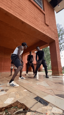 Young men perform dance routine in Kuru Karama, Nigeria