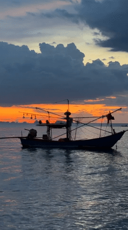 Sunset beach gathering at Baan Thong Po, Thailand