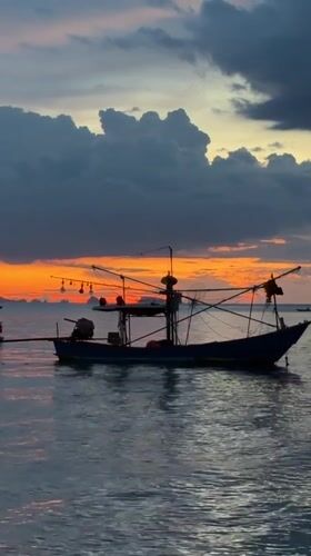 Sunset beach gathering at Baan Thong Po, Thailand