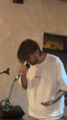 Intimate acoustic jam session with rotating vocalists and candlelight
