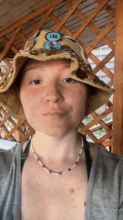 Pin collector displays decorated hat in Nizhny Novgorod gazebo