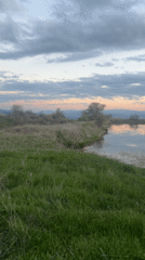 Sunset documented over water and mountains April 11