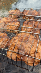 Backyard barbecue grilling session documented in Ukrainian village