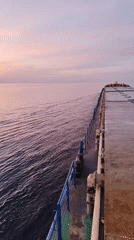 Ship passenger captures serene sunset over calm Russian waters