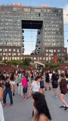 Dancing outside a bold architecturally distinctive New York building