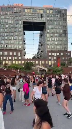 Dancing outside a bold architecturally distinctive New York building