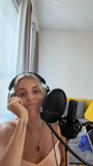 Woman records music in Bangkok home studio session