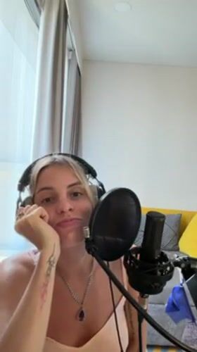 Woman records music in Bangkok home studio session