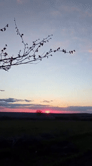 Sunset documented over rural farmland near Khlevnoye, Russia