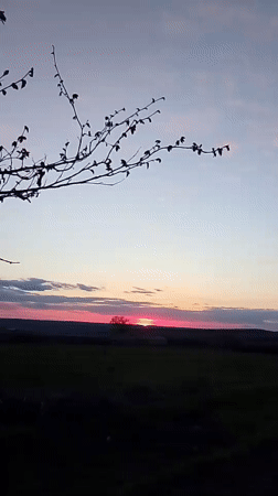 Sunset documented over rural farmland near Khlevnoye, Russia