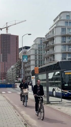 Morning urban documentation captures Amsterdam street life and architecture