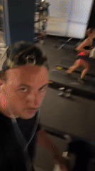 Inside a fitness facility: gym floor and indoor lap pool