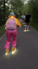 Group rollerblades with glowing skates in Krasnoyarsk park at dusk
