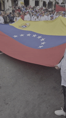 Venezuelan flag demonstrations and religious procession converge in Caracas
