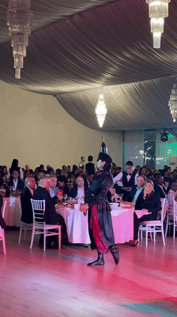 Traditional cultural dance performances at a formal indoor celebration