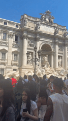 Tourist in white headscarf visits Rome's landmarks
