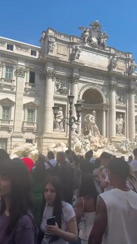 Tourist in white headscarf visits Rome's landmarks
