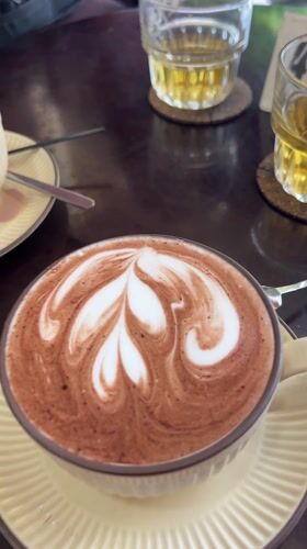 Morning coffee with latte art served in Nha Trang cafe