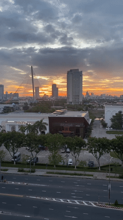 Đà Nẵng skyline at golden hour, Dragon Bridge front and center
