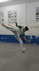 Capoeira practitioner performs spinning move in São Paulo