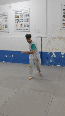 Capoeira practitioner performs spinning move in São Paulo