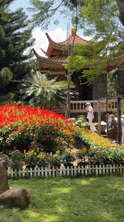 Tourists visit flower gardens and temple grounds in Da Lat