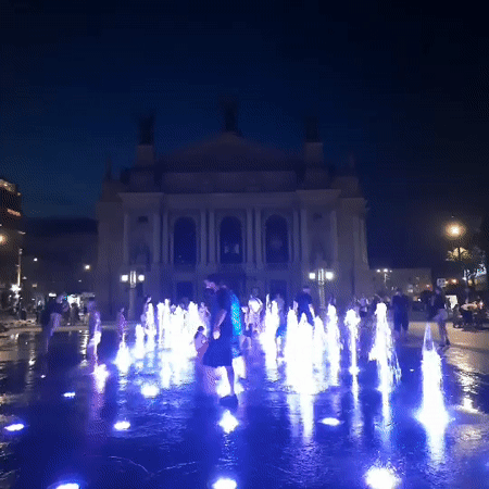 Evening at Lviv's National Museum plaza, fountain lit up