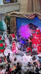 Indoor celebration with costumed performers draws crowds to retail venue