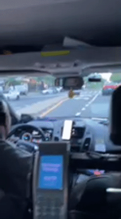 Passenger uses smartphone during late-night Manhattan taxi ride