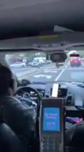 Passenger uses smartphone during late-night Manhattan taxi ride