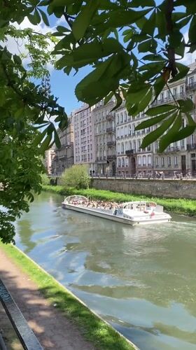 Tour boat carries passengers through Strasbourg canal