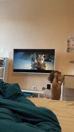 Resident watches creature feature film on television in Tobolsk