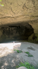 Tourist explores Bulgarian cave system and natural bridge formations