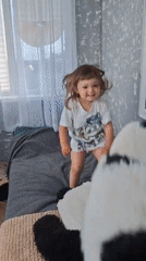 Kid and kitten share a quiet morning in a Kempelevo bedroom