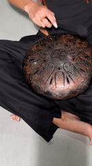 Street musician plays steel tongue drum in North Kuta