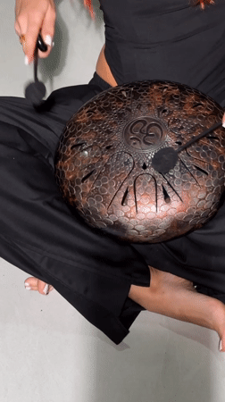 Street musician plays steel tongue drum in North Kuta