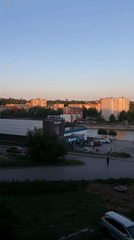 Sunburned woman takes selfies in Votkinsk at dusk