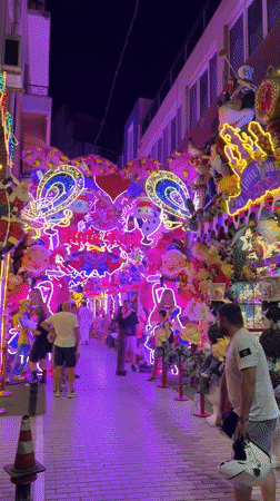 Little Kook's wildly decorated Athens streetfront at night