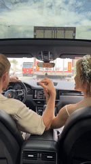 Wedding party travels by red Porsche through scenic route