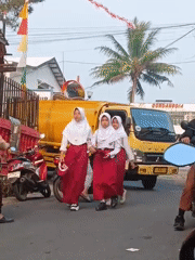 Busy school arrival scene outside SD Negeri Kopo 01