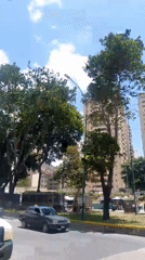 Ambulances, pedestrians observed during afternoon hours in central Caracas