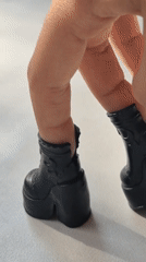 Miniature boots and toy feet get their close-up moment