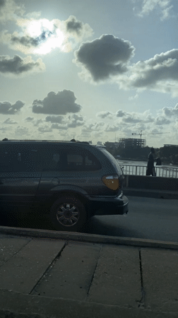 Pedestrian spotted on bridge sidewalk in Falomo, Nigeria