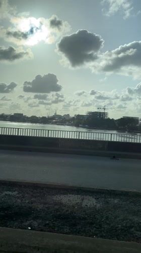 Pedestrian spotted on bridge sidewalk in Falomo, Nigeria