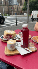 Morning cafe breakfast documented near Prague's St. Ludmila Church