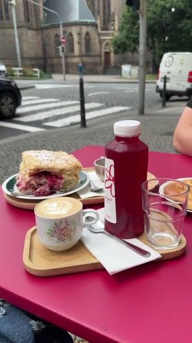 Morning cafe breakfast documented near Prague's St. Ludmila Church