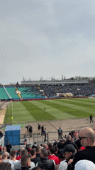 Soccer match draws crowd to colorful stadium seating