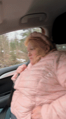 Driver navigates wet forest road; #InOrOut message captured