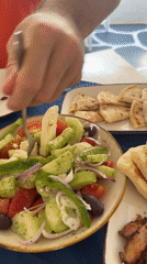 Greek restaurant patron dines outdoors in Denpasar, Indonesia