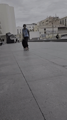Skateboarders perform tricks at Barcelona plaza